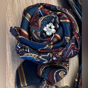 Reimagined necktie Brooch with Vintage Jewelry embellishment.